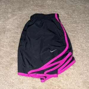 Pink and black Nike shorts